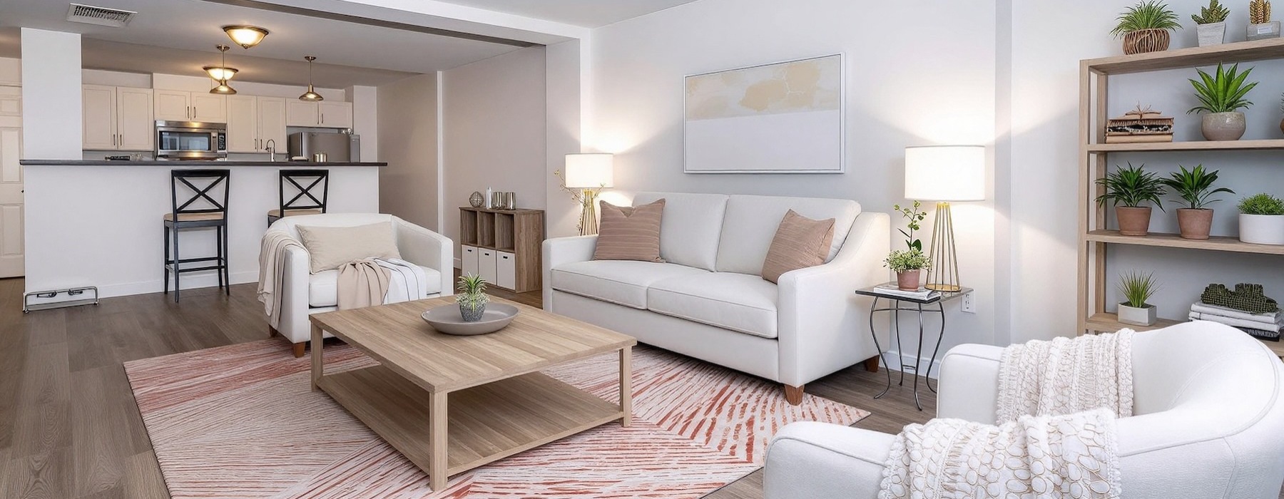 a living room with a couch, chairs and a coffee table