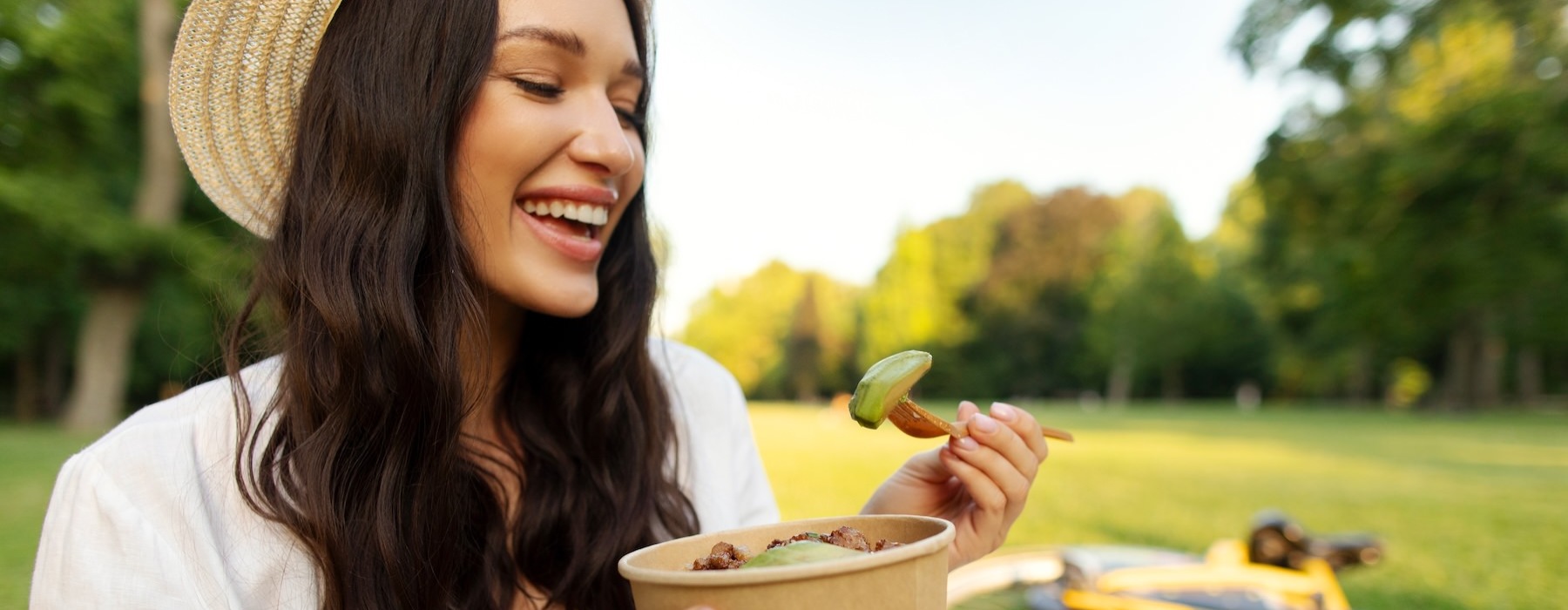 a woman holding a bowl of food